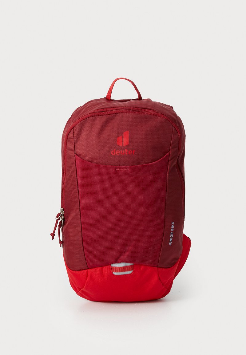 Red nylon backpack with a structured shape, featuring a front zip pocket, a carry handle, and “deuter” logo. Reflective accents included.