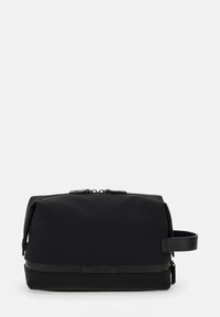 Svart nylon necessär med rundad design, dragkedjestängning upptill, sidohandtag och en slät yta. Minimalistisk stil utan synliga mönster.