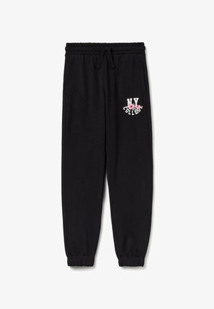 Sorte joggingbukser med elastisk talje og manchetter, forlommer og teksten "NY College" med pink blomsterdesign på venstre lår.