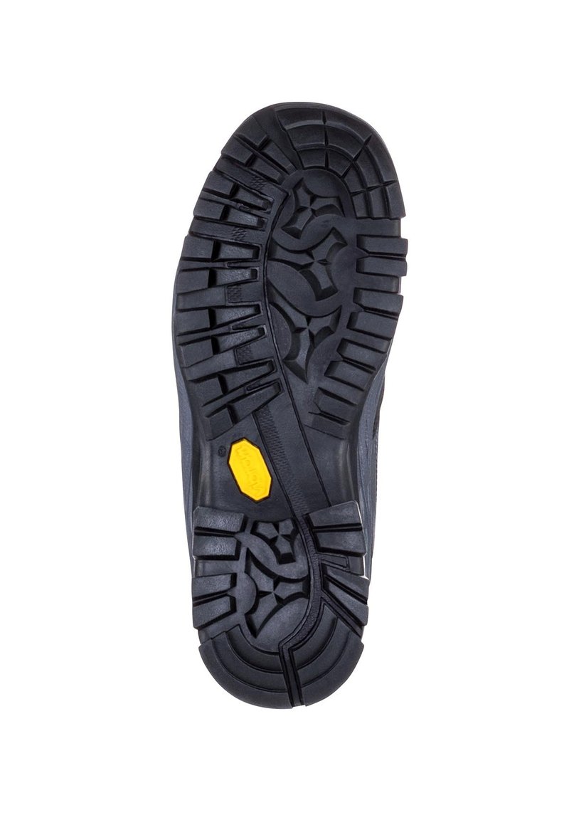 Czarna, solidna podeszwa boot z głębokim bieżnikiem i żółtym logo Vibram na środku, zaprojektowana z myślą o przyczepności i trwałości.