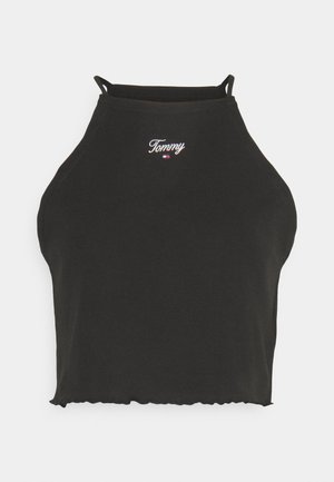 Musta puuvillainen halterneck-crop-top, jossa on pyöreä helma. Rintakehässä on valkoinen brodeerattu "Tommy"-logo ja ohuet säädettävät hihnat.