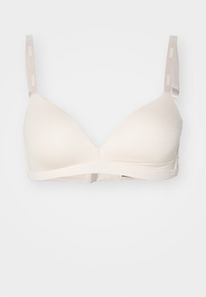 Béžový bavlnený bralet s hladkým povrchom, trojuholníkovými košíčkami, nastaviteľnými ramienkami a pohodlným pásom pod prsiami.