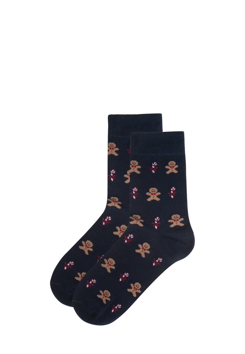 Marineblå sokker med et gentaget mønster af peberkager og slikstokke, strikket tekstur, midt-læg længde samt forstærket tå og hæl.