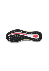 Sole di scarpa in gomma bianca e nera con una texture a motivo, caratterizzata da un accento rosso e una striscia centrale bianca. Design leggero e flessibile.