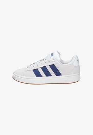 Light gray suede sneaker with three navy stripes, white accents, round toe, and a tan rubber sole. Features a lace-up design.