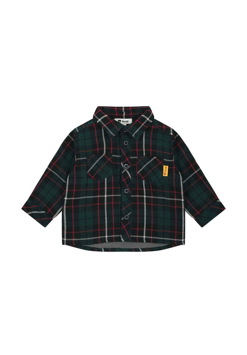 Camisa de cuadros verdes con botones y mangas largas, que presenta dos bolsillos en el pecho, cierre de botones y líneas en contraste rojas y grises.
