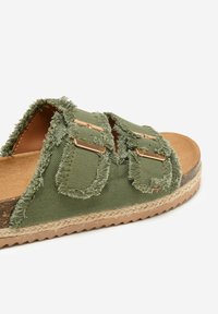 Green fabric sandal featuring two buckle straps, frayed edges, and a jute-wrapped sole with a textured brown insole.