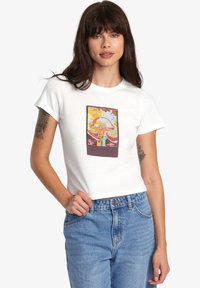White cropped t-shirt with short sleeves, featuring a colorful mushroom graphic in a brown outline centered on the front.