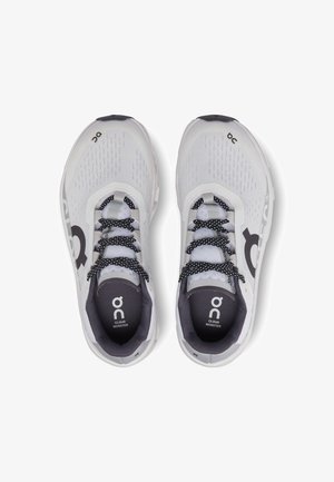 White and gray On Cloud Monster running shoes with black and white laces, viewed from above on a white background.