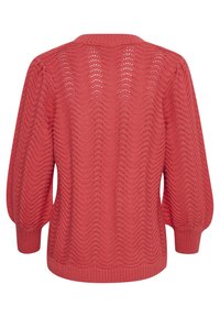 Ribbed, coral sweater with a wave pattern, featuring long sleeves and a round neckline, made from a knitted, textured fabric.