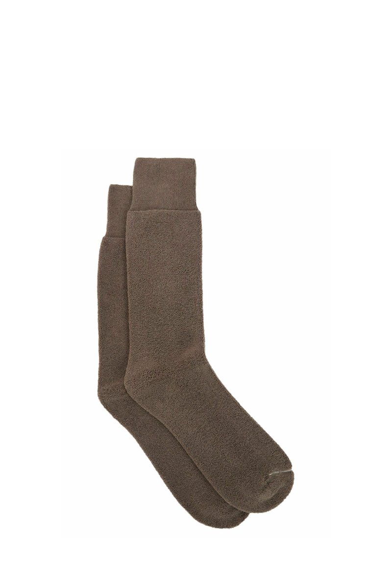 Brune, knæhøje sokker lavet af fleece-materiale med en ribbet manchette. Blød tekstur med en ensartet farve og uden fremtrædende mønstre eller detaljer.