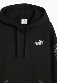 Black hoodie made of soft fabric featuring a kangaroo pocket, black drawstrings, and white Puma logo on the chest. Camo-patterned accent on sleeves.