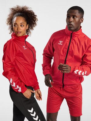 Hummel CORE XK SPRAY - Regenjacke / wasserabweisende Jacke - true red