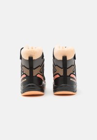 Black hiking boots with a plush cream inner lining, orange accents, textured mesh, and a patterned design on the sides. Features a pull tab.