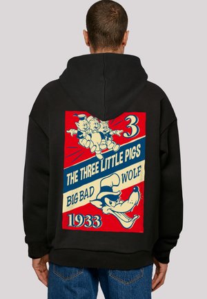 Black hoodie featuring a retro graphic of three pigs and a wolf, with red, blue, and cream colors, and text reading "The Three Little Pigs 1933."