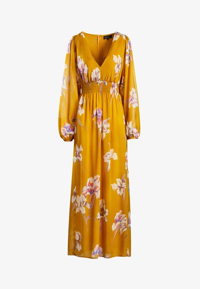 Květinové maxi šaty v jasně žluté barvě. Mají dlouhé, vypelichané rukávy, zúžený pas a hluboký V-výstřih. Květinové vzory v bílé a růžové barvě.