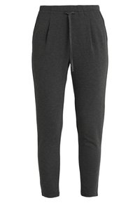 Dark gray jogger pants made of soft cotton blend. Features an elastic waistband with drawstring, tapered legs, and side pockets.