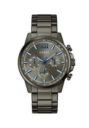 Dark gray metal Guess wristwatch with blue hour markers, three subdials showing 24-hour time, day of week, and 60-second timer.