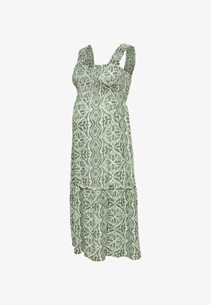 Vestido de maternidad sin mangas con patrón geométrico verde y blanco, talle imperio y falda de volantes en capas.