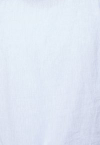 Light blue linen fabric with a soft, textured surface and a slightly sheer appearance, displaying subtle variations in hue.