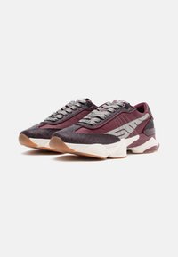 Maroon and black athletic shoes with a textured upper, metallic laces, a white midsole, and a rubber outsole featuring a gum accent.