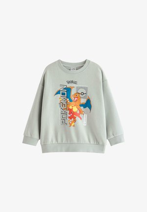 Lichtgrijze trui met kleurrijke Charizard-, Charmander- en Charmeleon-Pokémon-personages met de tekst "Pokémon" en een Poké Ball-afbeelding.