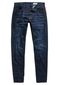 Jeans de mezclilla azul oscuro con un corte slim. Cierre de botón, cinco bolsillos y un ligero desgastado en la tela. Detalles de costura visibles.