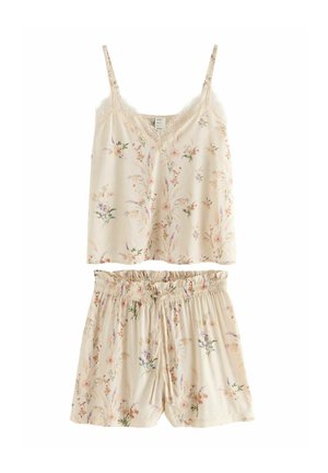 Ensemble de pyjama floral comprenant un haut sans manches avec bordure en dentelle et un short avec une taille élastique, le tout en tissu crème doux avec des motifs floraux pastel.
