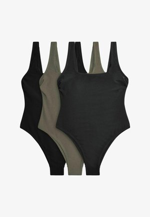 Kolm musta ja oliivrohelise värvi varrukateta, kõrge lõikega bodysuiti, mis on üksteise peale valgel taustal laotatud.