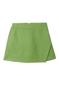 Groene mini-rok met textuur en rechte snit, met een ritssluiting aan de achterkant en twee zijzakken. De stof heeft een subtiel weefpatroon.