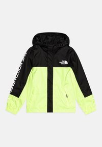 Ljusgul och svart vindjacka med huva, försedd med The North Face-logotyp och elastiska ärmslut. Tillverkad av lätt, vattentåligt material.