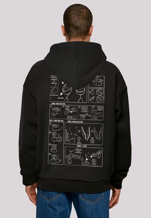 Black hoodie with a large graphic print on the back, featuring instructional sketches in white, depicting construction details of various elements.