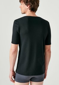 Damart COL V MANCHES COURTES THERMOLACTYL - Maglietta intima - noir