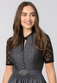 Dark grey dress with a textured bodice, lace short sleeves, detailed buttons, and a decorative belt buckle. Soft, flowing skirt.