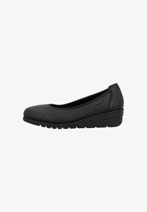 Chaussure compensée femme en cuir noir texturé avec bout arrondi et semelle légèrement rainurée, logo de la marque visible près du talon sur le côté.