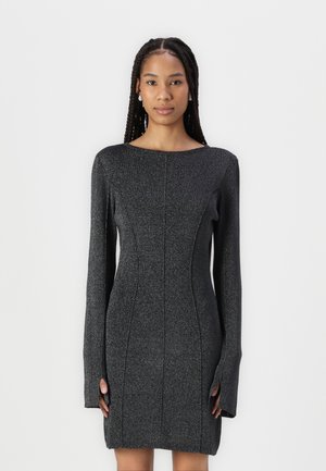Black, long-sleeve dress made of textured fabric with a fitted silhouette. Features vertical seam details and a round neckline.