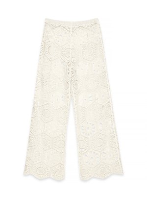 White crochet wide-leg pants featuring hexagonal patterns, scalloped edges, and an elastic waistband for an open, airy design.