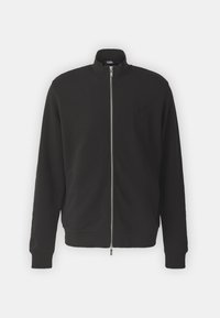 Juodas zip-up džemperis su aukštu apykakle, pagamintas iš minkštos medžiagos. Yra subtilus įspaustas logotipas ant krūtinės ir žakardo rankogaliai.