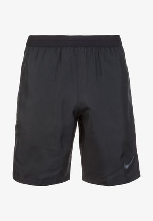 Zwarte sportshorts gemaakt van lichte stof, met een elastische tailleband en een subtiele Nike-logo op de onderkant van het rechterbeen.