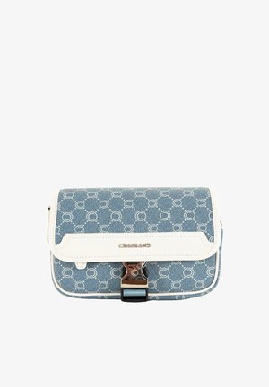 Sac à main en denim bleu avec des motifs ronds blancs, contour blanc et quincaillerie en argent. La fermeture dispose d'un loquet métallique pour la sécurité.