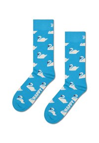 Niebieskie bawełniane skarpetki z powtarzającym się wzorem białych łabędzi z czerwonymi akcentami. Na podeszwie znajduje się napis "HAPPY".