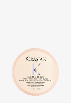 Masque capillaire crémeux hydra-lissant Kérastase Gloss Absolu pour cheveux épais et frisés, avec acide hyaluronique, acide glycolique et huile de rose sauvage.