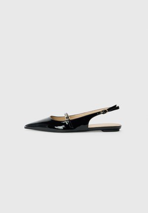 Black patent leather slingback shoe with a pointed toe, small decorative strap and buckle detail, flat sole, and minimal cutouts.