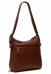 Sac en cuir marron à bandoulière avec une seule sangle, comportant une poche frontale zippée, une texture lisse et de subtils détails de couture.