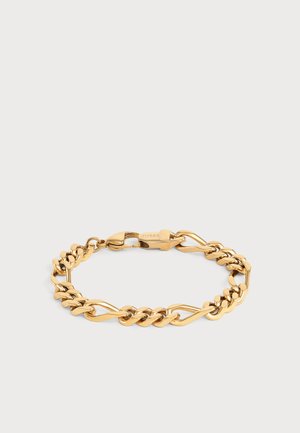 Bracelet chaîne doré avec des maillons ovales torsadés et lisses et une fermeture mousqueton gravée de "Guess".