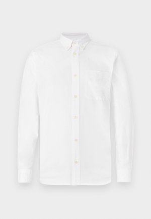 White, long-sleeve button-up shirt in cotton, featuring a pointed collar, seven buttons, and a single chest pocket with a subtle texture.