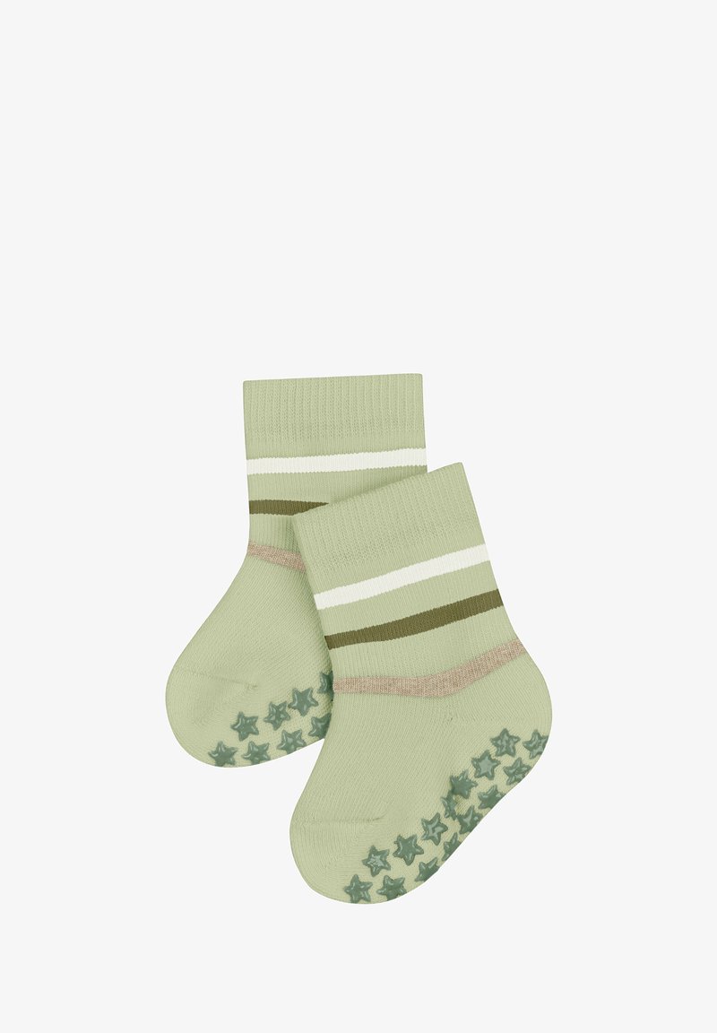 Chaussettes tricotées vertes avec des rayures blanches, olive et roses. Semelle texturée avec motif d'étoiles pour une meilleure adhérence. Tissu doux, hauteur mi-mollet.