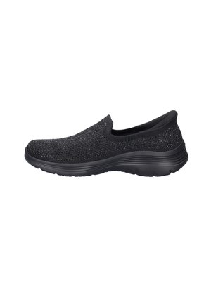 Black slip-on sneaker with knit upper and subtle sparkle detail, cushioned sole, and rounded toe, shown from the side on a white background.