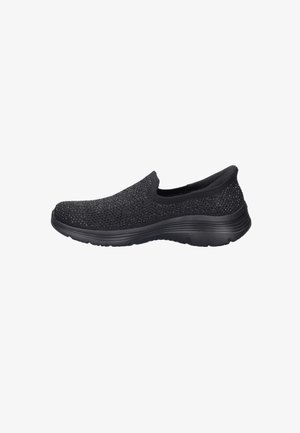 Black slip-on sneaker with knit upper and subtle sparkle detail, cushioned sole, and rounded toe, shown from the side on a white background.