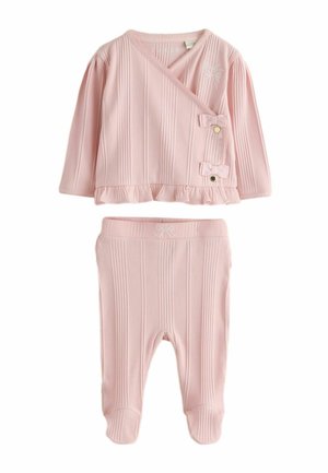 Soft pink ribbed baby outfit with long-sleeve wrap top featuring bows and matching footed pants with a subtle bow detail.